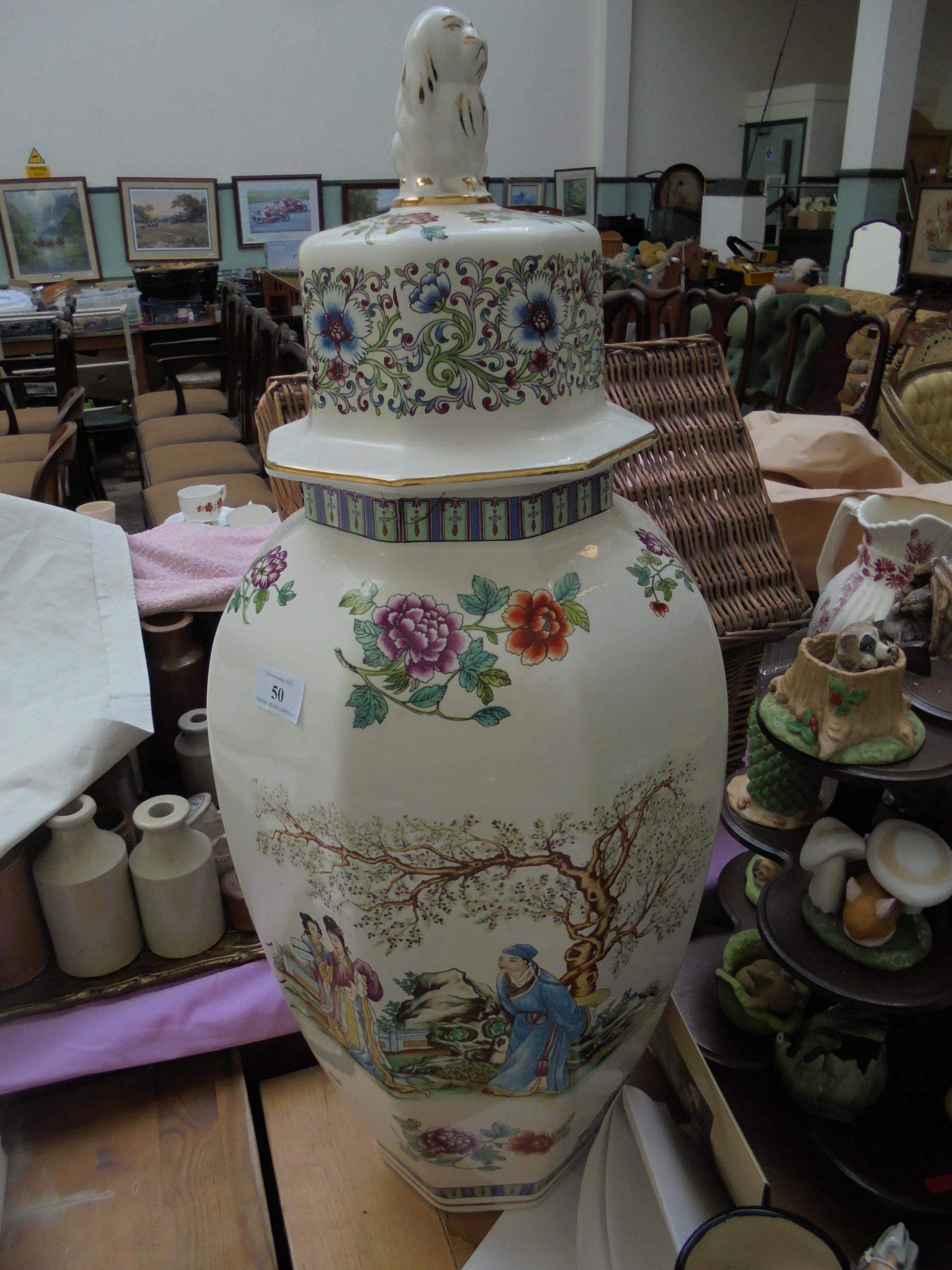 Tall lidded multi-coloured Oriental vase painted garden scene of suitor with 2 Geisha Girls,