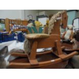 Modern rocking horse with studded padded seat