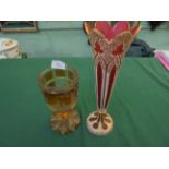 Large heavy brown glass goblet on circular facetted base,