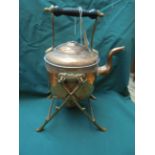 Smaller copper kettle on stand