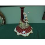 2 piece candleholder/table centrepiece in maroon with seated young gentleman dressed in