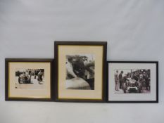 Three framed and glazed photographs of cars and their drivers in the pits/paddock at Brooklands,