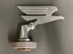 An unusual Art Deco style mascot, raised upon a radiator cap base, with integral temperature gauge