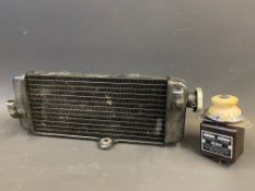 A boxed Horstmann Auto Time Control plus a narrow radiator core, appears new.