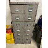 A fourteen drawer metal workshop filing cabinet, full of tools.