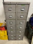 A fourteen drawer metal workshop filing cabinet, full of tools.
