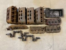 Four Austin 7 blocks, three cylinder heads, two crankshafts, a sump and an exhaust manifold.