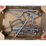 A box of T-bars, wrenches and sockets.