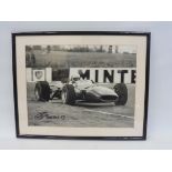 A framed and glazed photograph of Scarfiotti in Ferrari 312, 19 x 15 1/4".