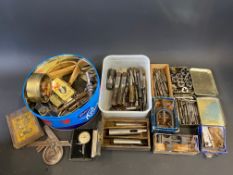 A collection of taps and dies plus assorted precision engineering tools.