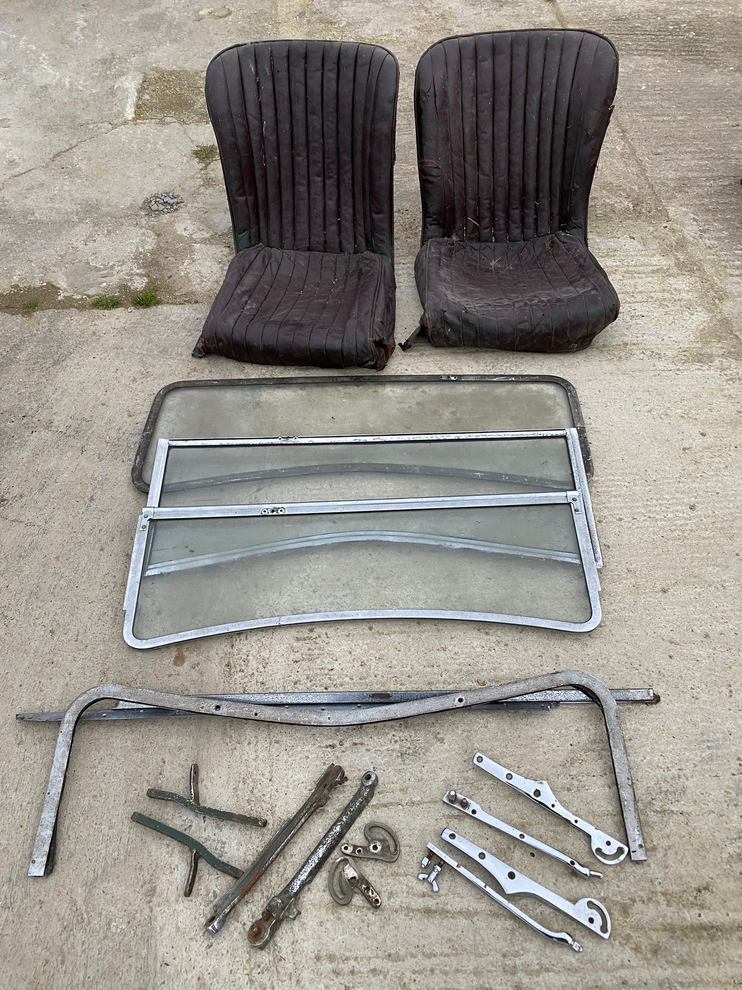 A pair of Riley front seats to suit a 12/4 Kestral or Adelphi, a windscreen for a 1930/32 Riley