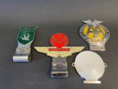 Four assorted car badges including Aston Martin Owners Club and Cambridge University Automobile