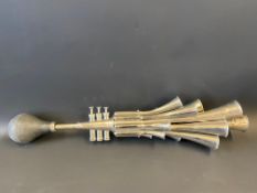 An unusual chrome plated bulb horn with 16 trumpets.