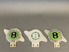 Three used Bentley Driver's Club car badges, two chrome/enamel and one early cast alloy.