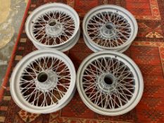 Four 16" wire wheels, two new circa 2004, two refurbished also circa 2004, by Philip Halliwell,