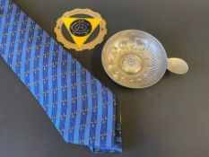 An Automobile Club de l'Ouest members silk tie, a car badge and a pewter ashtray.