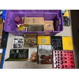 A large box of assorted washers, split pins, and other workshop items.