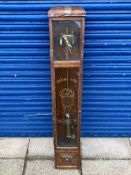 An oak cased wall clock, with decorative etched glass panel bearing Michelin advertising.