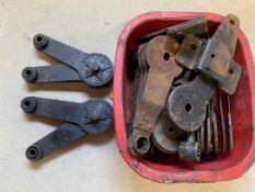A pair of Andre Hertford shock absorbers, plus a box of shock absorber spares and chassis parts.