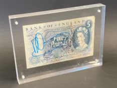 An old blue Five Pound note, autographed to both sides with 17 signatures of Formula 1 drivers