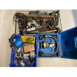 A crate of parts and equipment, a radiator leak checker tool and a tray of tools including a spray
