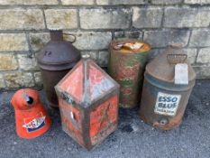 A Castrol Motor Oil embossed five gallon can, a later Castrol can and an Esso Blue five gallon