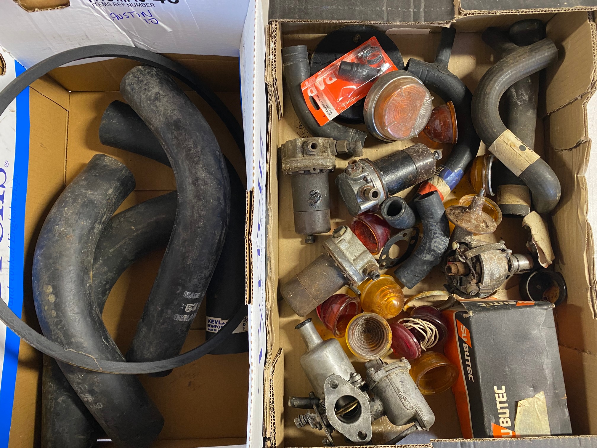 A box of Morris 1000 parts plus various hoses.