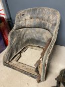 A Veteran or Edwardian bucket seat with original upholstery, lacking squab.