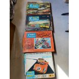 Three boxed Tri-ang Minic Motorways sets plus a miniaturised lo-speed electric motor racing set.