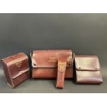 Four leather cased motorist's accessory kits including a torch tool kit.
