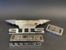 A small group of car insignia/badges including a 911S, Sebring etc.