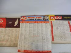 A quantity of KLG and AC Spark Plugs hanging information charts.