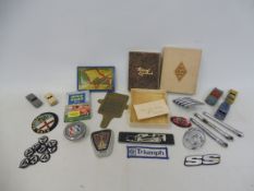 A selection of assorted motoring collectables, badges, insignia etc.