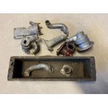 A quantity of Alvis Firebird water pumps and engine castings.