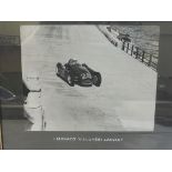 A framed and glazed photograph of Villoresi in a Lancia, 14 3/4 x 11 3/4".