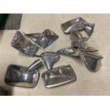 A collection of seven chrome wing/door mounted exterior rear view mirrors.