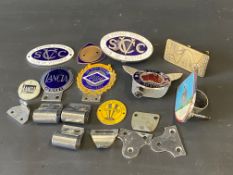 A selection of enamel car badges including The Vintage Sports Car Club of Victoria, Lancia Motor