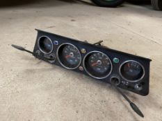 A dash panel with a complete set of instruments, possibly Hillman Hunter, with unusual feature of