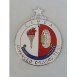 A CAMDA Advanced Driving Test type 3 enamel car badge with 'Graduate' token attached.