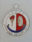 A CAMDA Advanced Driving Test type 3 enamel car badge with 'Graduate' token attached.