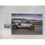 A photograph on stretched canvas of Hermann Lang in a 1937 Mercedes Benz W125, with certificate of