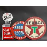 A reproduction Shell enamel sign, a handpainted Texaco sign and a circular Continental road sign