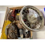 A box of Austin parts plus an Austin 7 wheel.