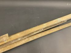 Five brass bulk tank dipsticks.