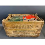 A rare Pratts wooden delivery crate for two gallon petrol cans, containing two Pratts, one Esso