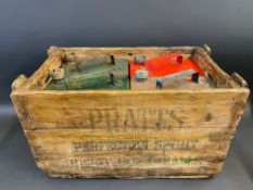 A rare Pratts wooden delivery crate for two gallon petrol cans, containing two Pratts, one Esso