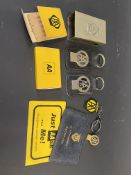 A small collection of AA related keyrings, badges, matchbox holder etc.