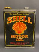 A Shell Motor Oil rectangular gallon can, of bright colour.