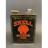A Shell Motor Oil rectangular half gallon can.