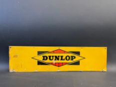 A Dunlop rectangular tin advertising sign, 24 1/2 x 6 1/2".